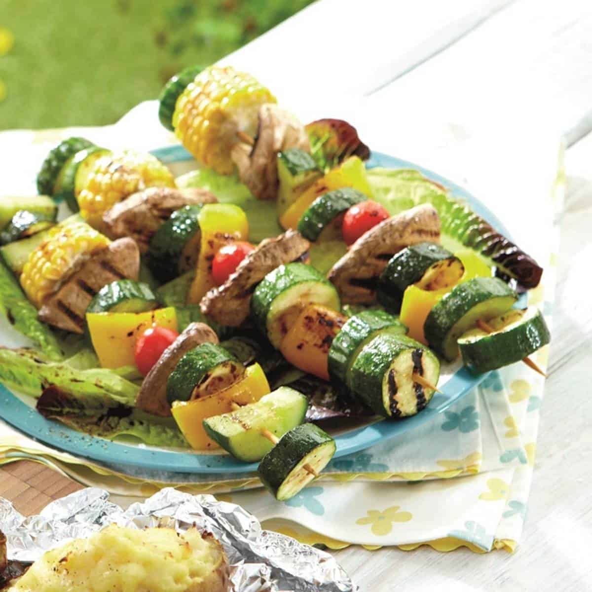 grilled vegetable skewers drizzled with balsalmic vinegar.
