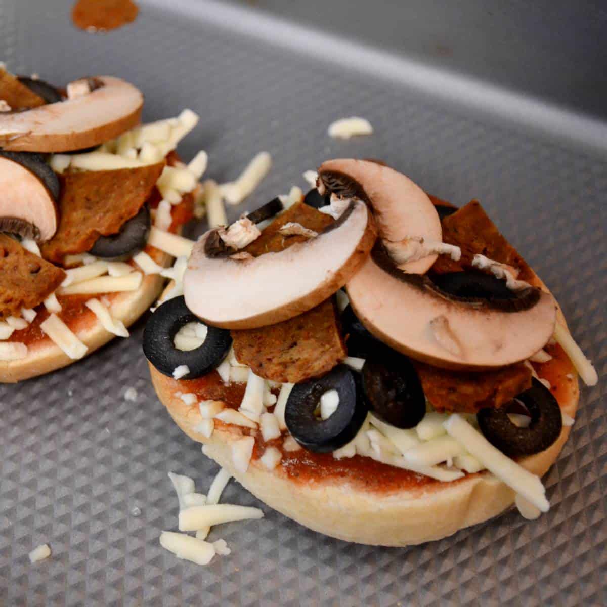 step five in assembling pizza bagels.