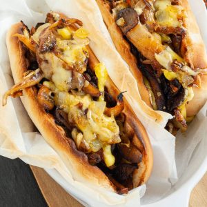 gooey cheesesteak like sandwiches in parchment paper.