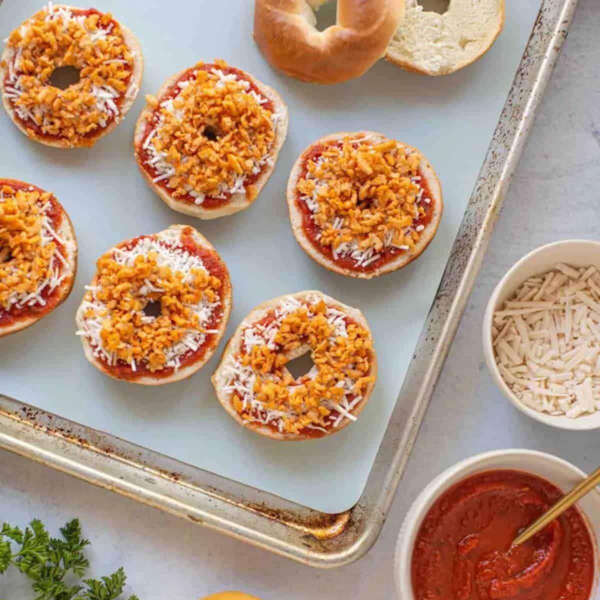 mini bagels topped with pizza toppings.