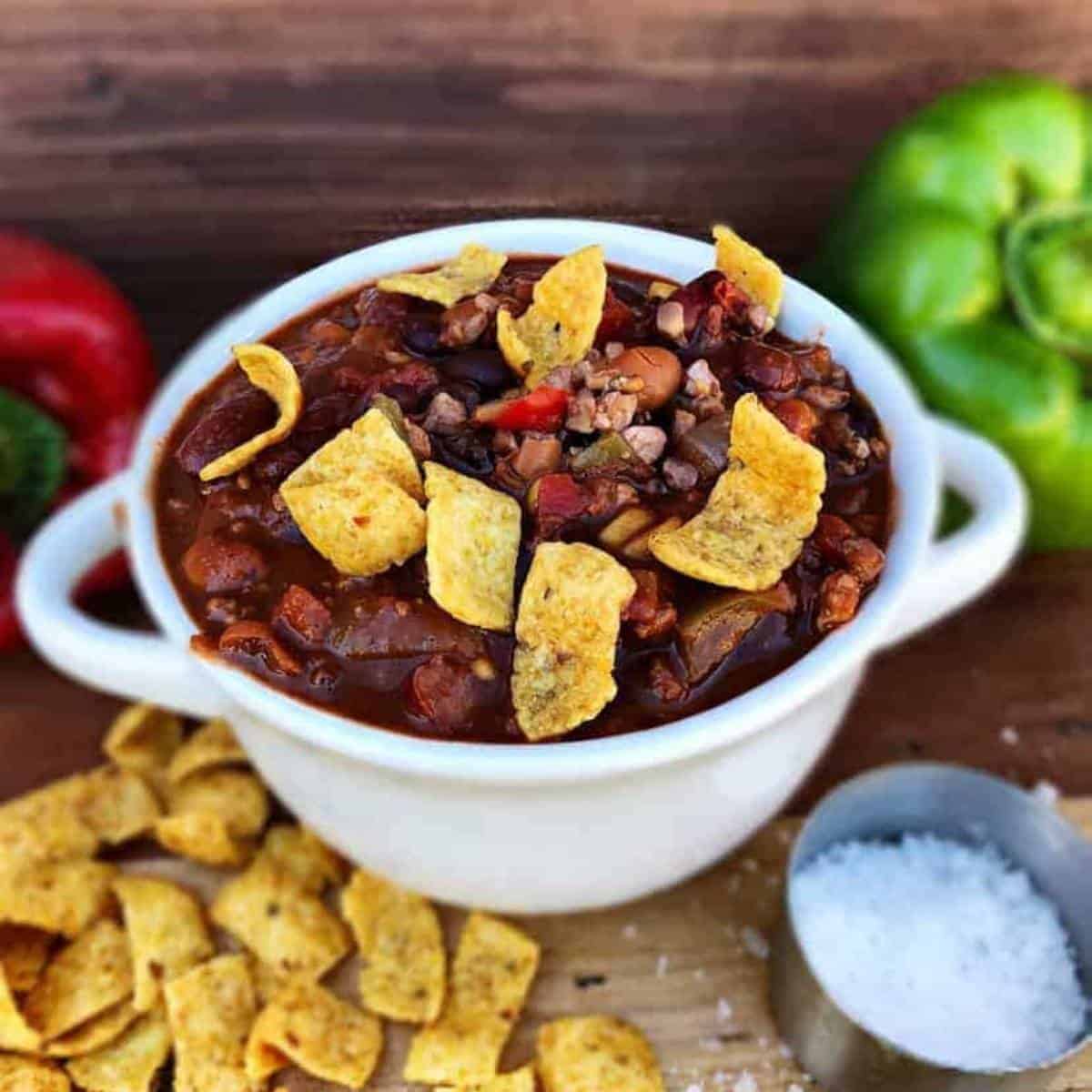 veggie chili topped with corn chips and walnuts