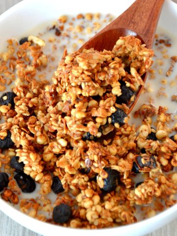 blueberry granola in a bowl of oat milk.