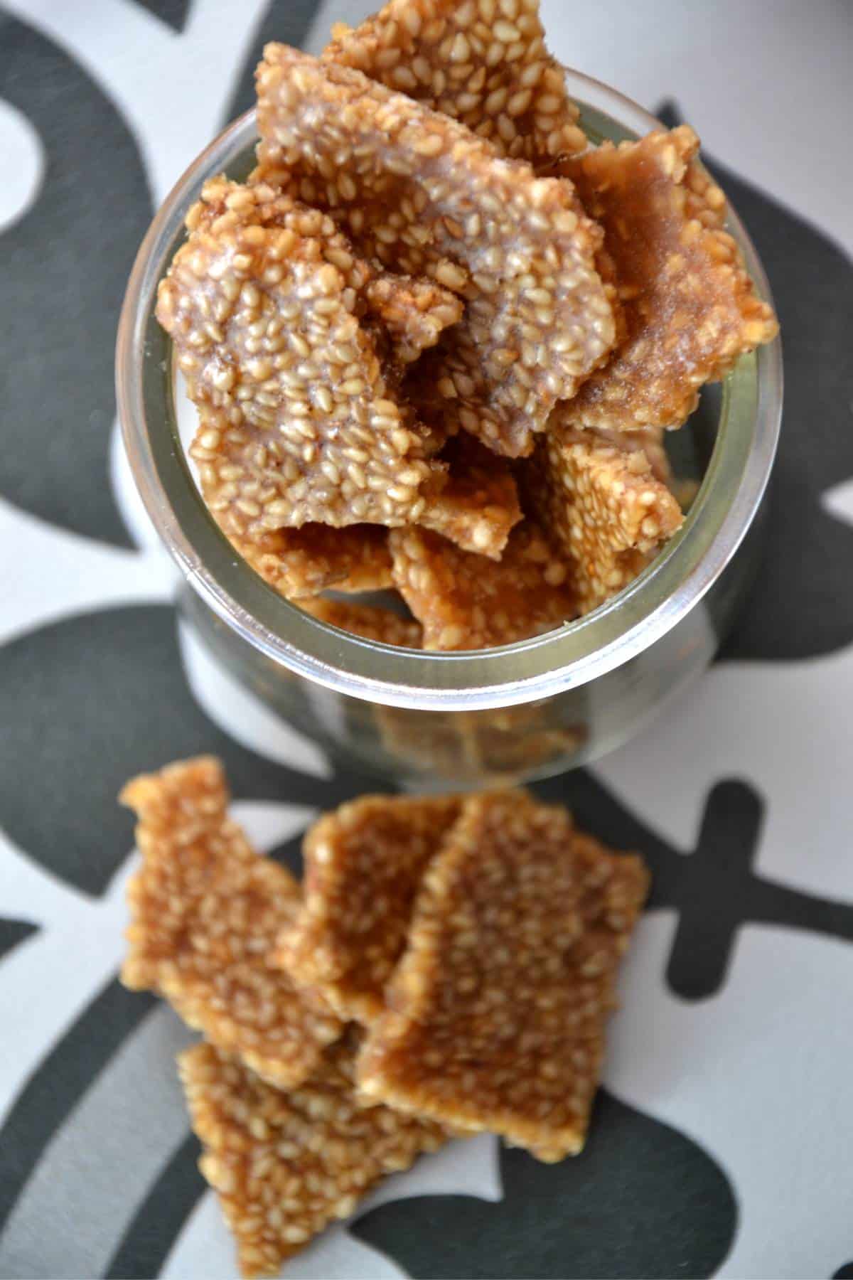 looking from the top down onto the jar of sesame brittle.